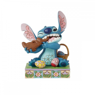 Figura enesco diseny stitch comiendo conejo de chocolate con huevos