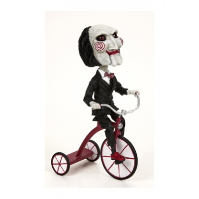 Figura neca saw head knocker puppet on tricyclesue)