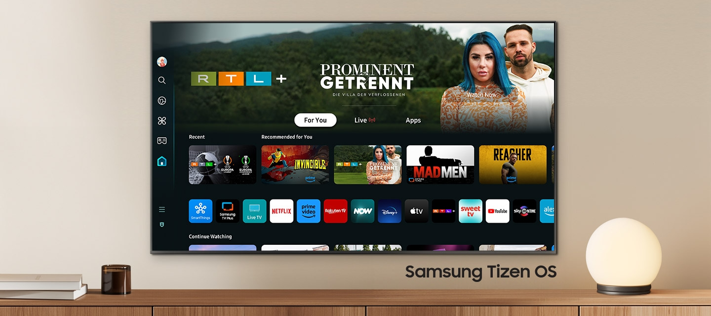 A wall-mounted TV shows popular apps and curated content on the home menu. "Samsung Tizen OS"